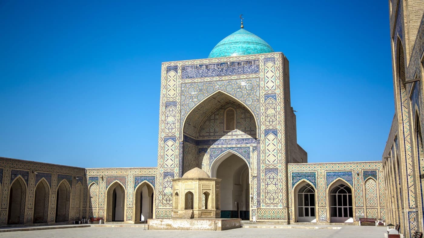 The courtyard of the Kalyan Mosque with its turquoise dome and main iwan