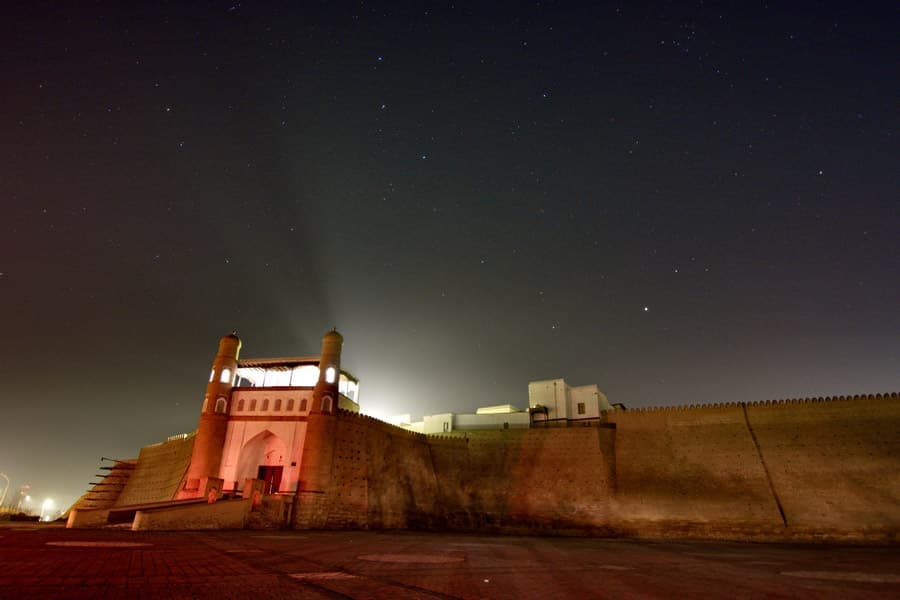 The fortress wall at night under a sky full of stars
