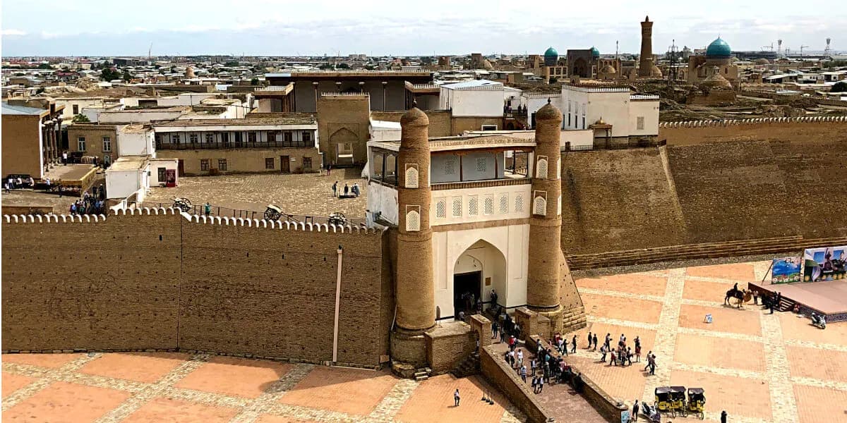 The fortress gate with the old city skyline behind it