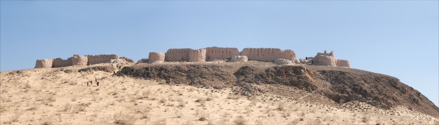 Wide view of an Ayaz-Kala fortress on its hill under a clear sky