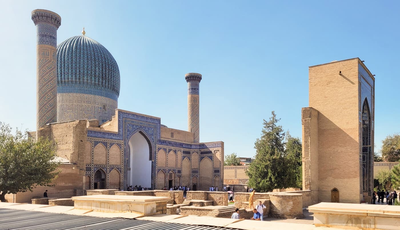 Gur-Emir from the side: the ribbed blue dome, two minarets and the entrance portal