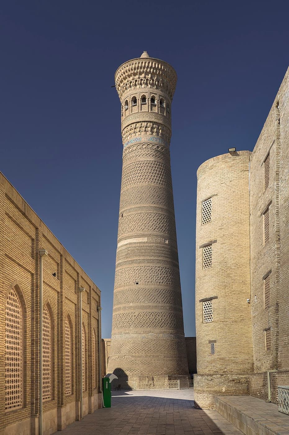 The full height of the Kalyan Minaret, its fourteen bands of brick ornament visible