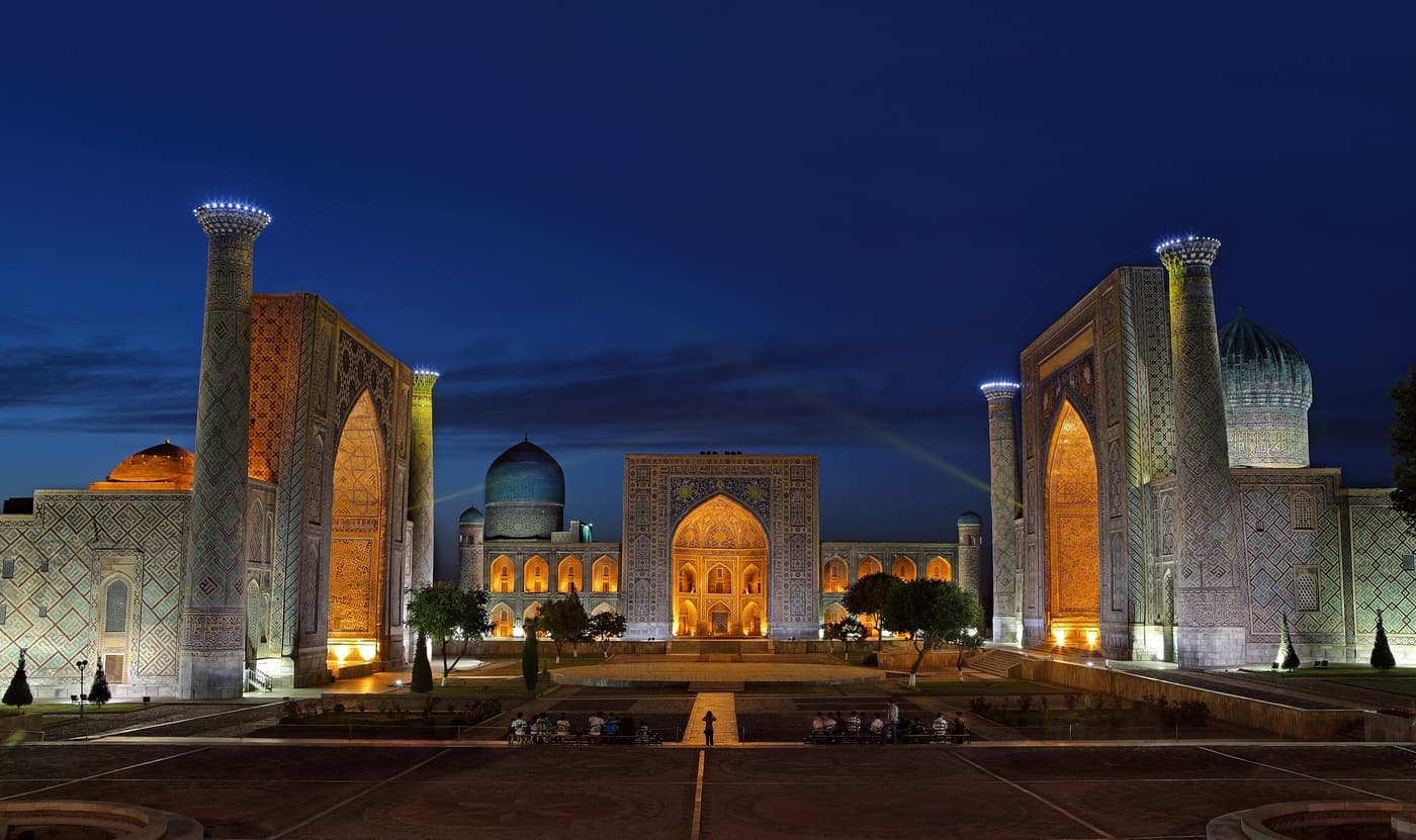 The Registan at night with the three madrasas lit up